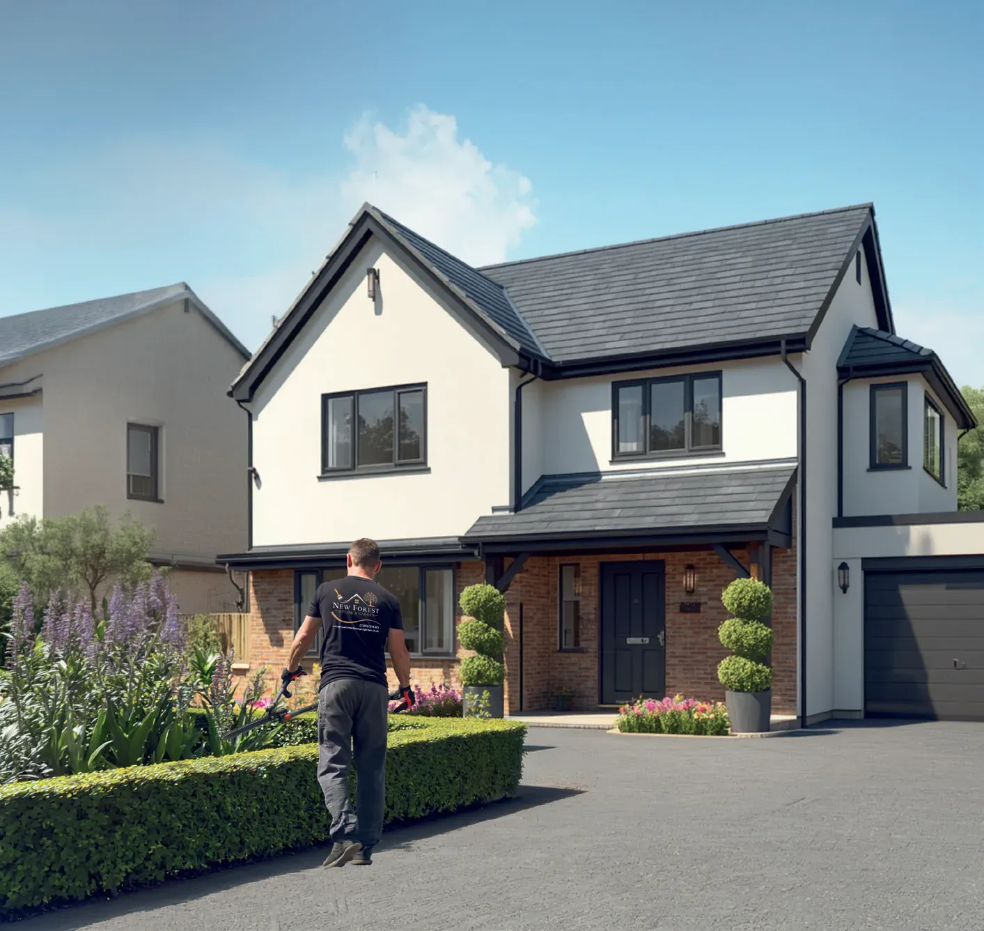 Tradesman in a branded shirt walking past a neatly trimmed hedge in front of a detached house